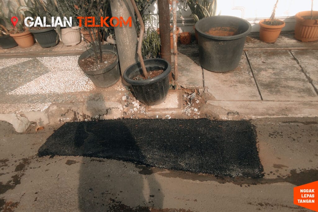 tambal jalan lubang